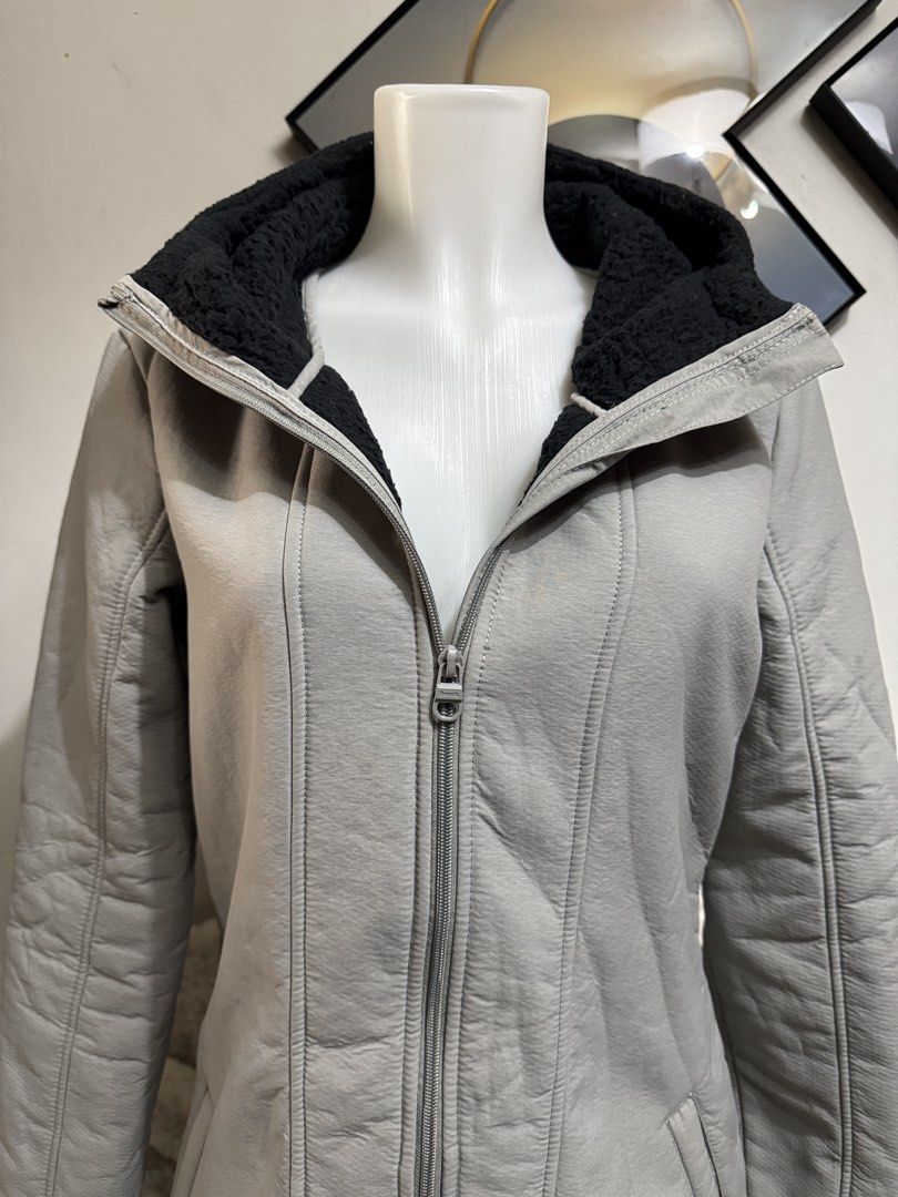 Bench grey hooded fleece lined winter jacket coat (Category: Coats, Jackets and Outerwear) located in Marikina City. Submitted by lorradel (Listing ID 1464829807, Image 3). Description: - Brand: Bench - Color: Grey with warm black fleece lining inside the hood and collar - Fit: Structured paneling down the front and back for a flattering, fitted shape - Pockets: Two functional front welt pockets - Details: Embroidered Bench logo on the left sleev