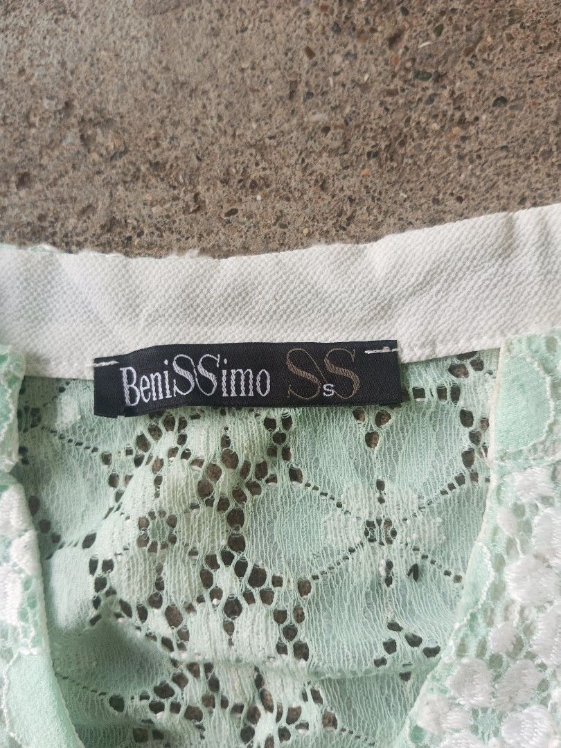 BeniSSimo Lace Blouse Mint Green (Category: Blouses) located in Manila. Submitted by anjo1 (Listing ID 1464878376, Image 2). Description: - Brand: BeniSSimo SS - Color: Mint green with a floral lace pattern - Details: V-neckline, white contrasting collar band, 5 white front buttons - Sleeves: Short flutter sleeves - Material: Lightweight, ideal for warm weather - Styling: Great to pair with high-waisted skirts and jeans.