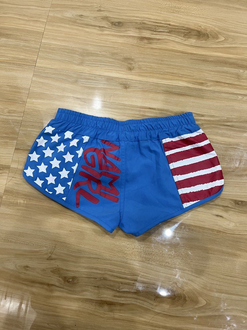Bikini Shorts (Category: Bikinis & Swimsuits) located in Angeles City. Submitted by thriftsij (Listing ID 1464943349, Image 2). Description: - Brand: Nami Girl (Japanese Brand) - Free size 26-30 - Design: Blue body with red & white stripes on one side, white stars on the other, and 'I Love Bikini' pocket accent - Ideal for beach trips, swimming, and summer outings.