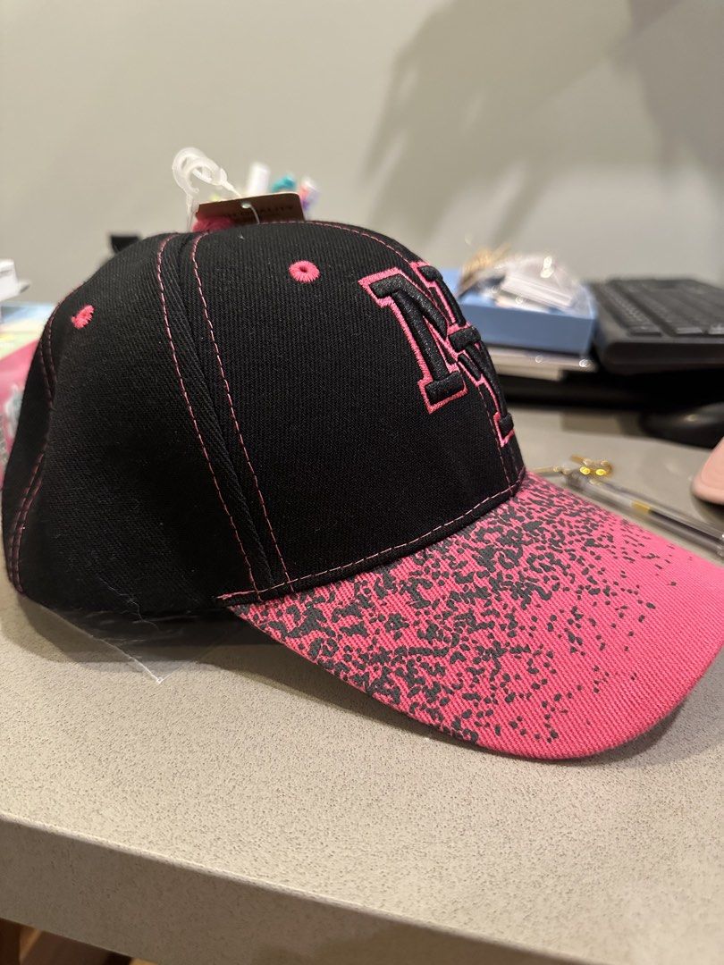Black & Pink NY Embroidered Baseball Cap (Category: Caps & Hats) located in Makati City. Submitted by kobeskorner (Listing ID 1464919700, Image 3). Description: Black & Pink NY Embroidered Cap 🩷🖤 Brand new with tag Black cap with hot pink leopard-print brim Adjustable back Never worn.