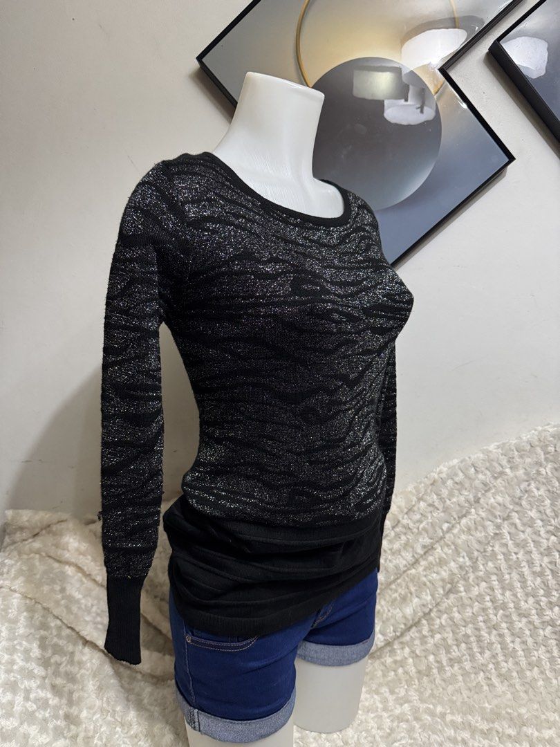 Black and Silver Shimmer Knit Sweater (Category: Coats, Jackets and Outerwear) located in Marikina City. Submitted by lorradel (Listing ID 1464836334, Image 3). Description: - fits S-M - Color: Sleek black with a subtle shimmering metallic pattern - Fit: Comfortable stretchy knit material with a round neckline - Design: Ribbed cuffs and an extended ribbed hem for a stylish layered look - Perfect for: Cooler weather, date nights, and evening outin