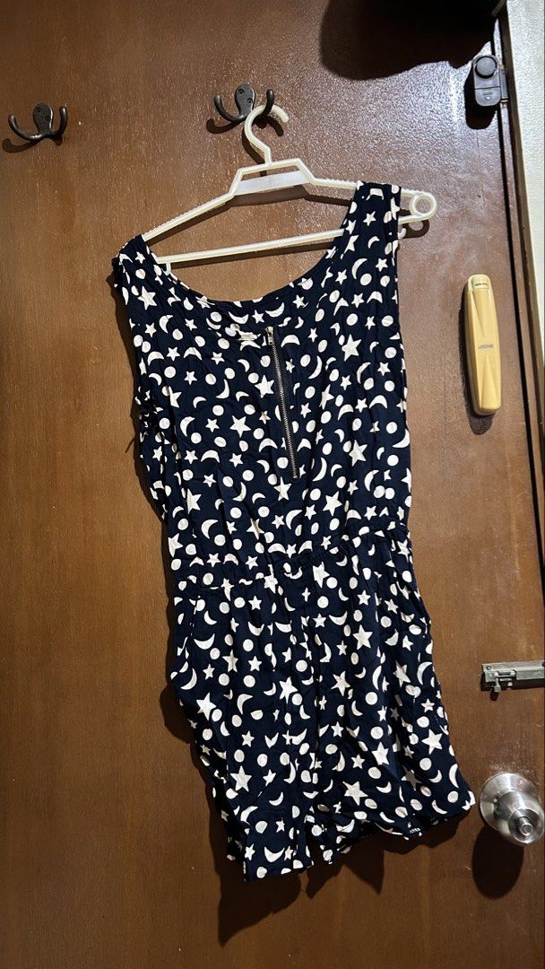 Black and White Celestial Print Romper with Zipper Back (Category: Rompers) located in Cabuyao City. Submitted by pickedbyarya (Listing ID 1464832800, Image 2). Description: Size XS-S W 12-18 (stretchy) x L 23 in Zipper sa likod - Design: Black and white with star, moon, and polka dot print - Fit: Sleeveless, scoop neckline, relaxed shorts, and comfy elastic waistband - Closure: Convenient back zipper on the upper back - Material: Lightweight fab