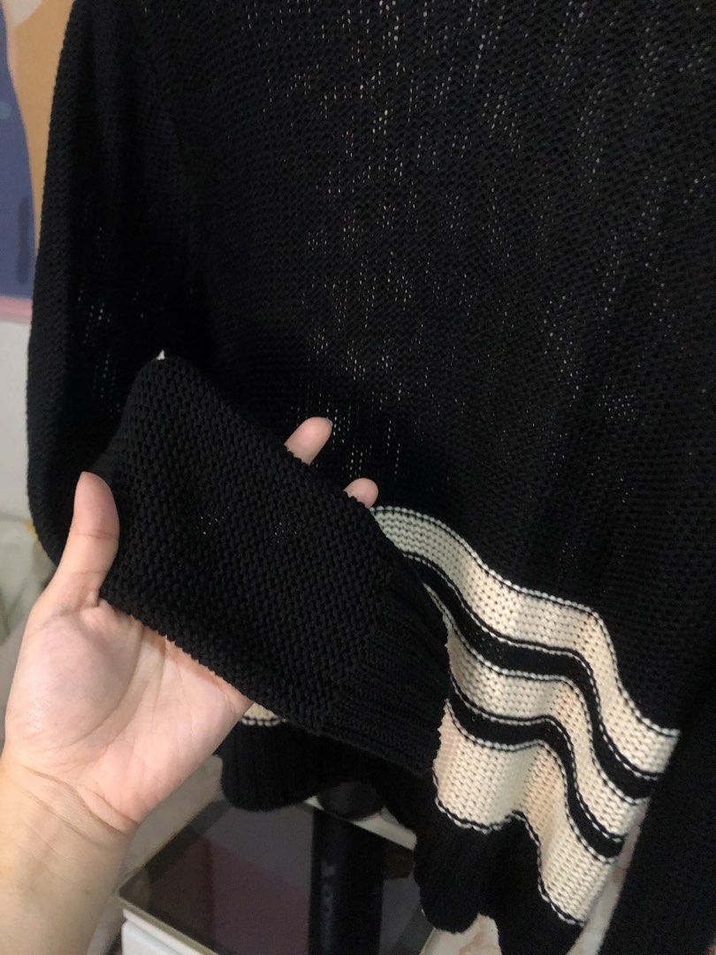 Black and White Striped Knit Sweater Size M (Category: Longsleeves) located in Cauayan City . Submitted by wholly.craaaft (Listing ID 1464946837, Image 3). Description: - Style: Black knit sweater with wide cream and black stripes at the hem - Design: Long sleeves, round neckline, and lightweight open-knit fabric - Size: Medium (tag attached inside collar) - Condition: Clean, excellent, with no obvious flaws - Perfect for layering and casual days