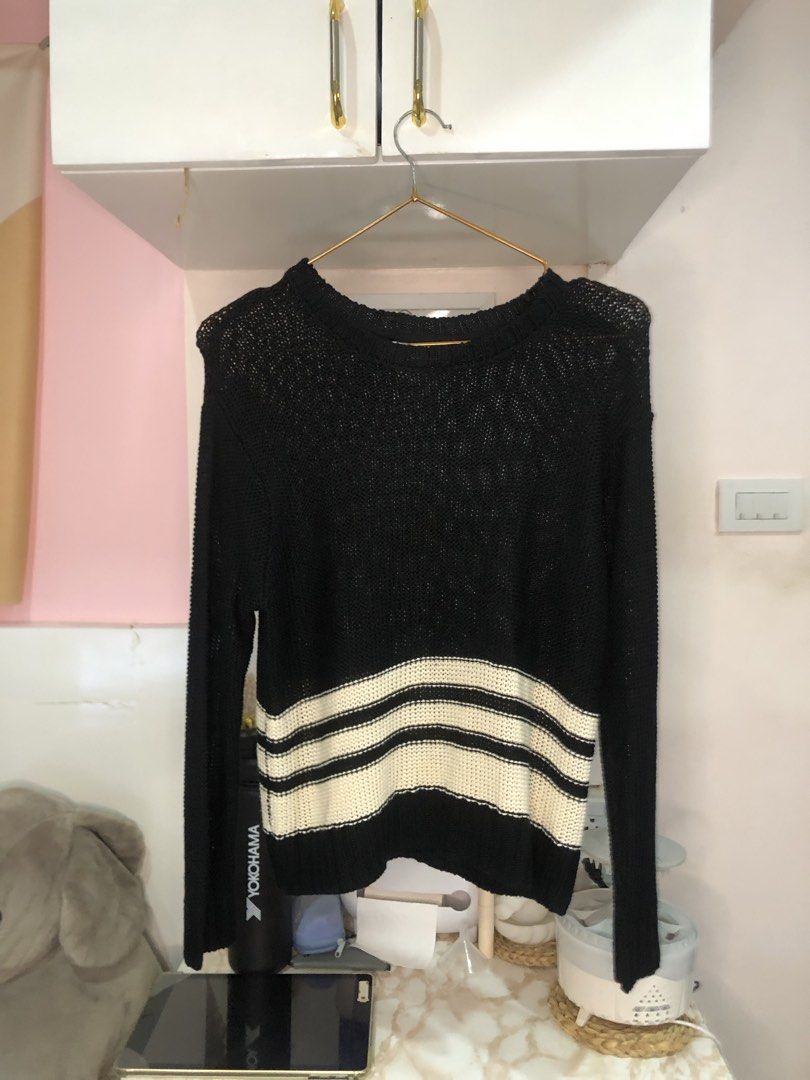 Black and White Striped Knit Sweater Size M (Category: Longsleeves) located in Cauayan City . Submitted by wholly.craaaft (Listing ID 1464946837, Image 1). Description: - Style: Black knit sweater with wide cream and black stripes at the hem - Design: Long sleeves, round neckline, and lightweight open-knit fabric - Size: Medium (tag attached inside collar) - Condition: Clean, excellent, with no obvious flaws - Perfect for layering and casual days