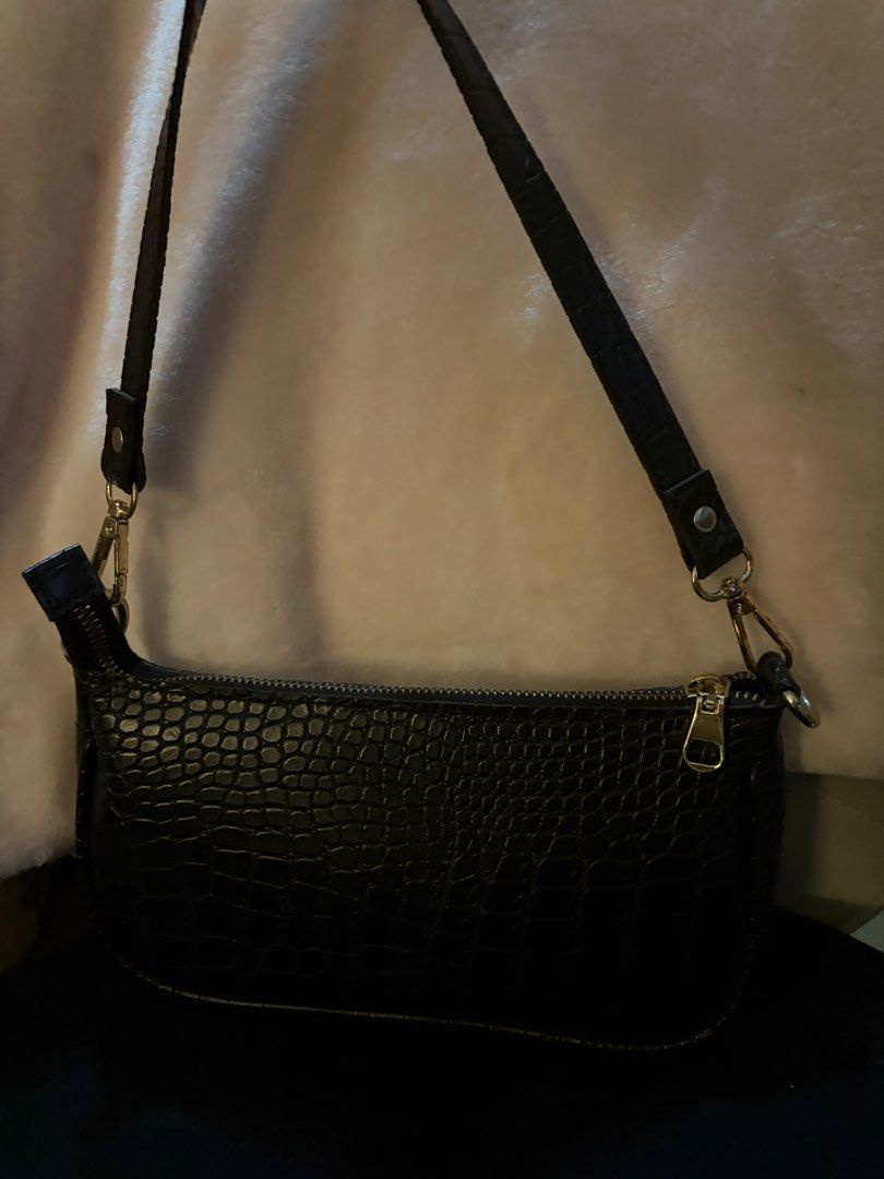 Black Croc Embossed Shoulder Bag (Category: Shoulder Bags) located in Manila. Submitted by sc.moo04 (Listing ID 1464944699, Image 1). Description: - Color: Classic Black with stylish crocodile-embossed pattern - Hardware: Elegant gold-tone accents on zippers and strap clips - Closure: Secure top zipper to keep your essentials safe - Interior: Clean fabric lining - Strap: Adjustable and removable with trendy snap button details - Size: Compact and