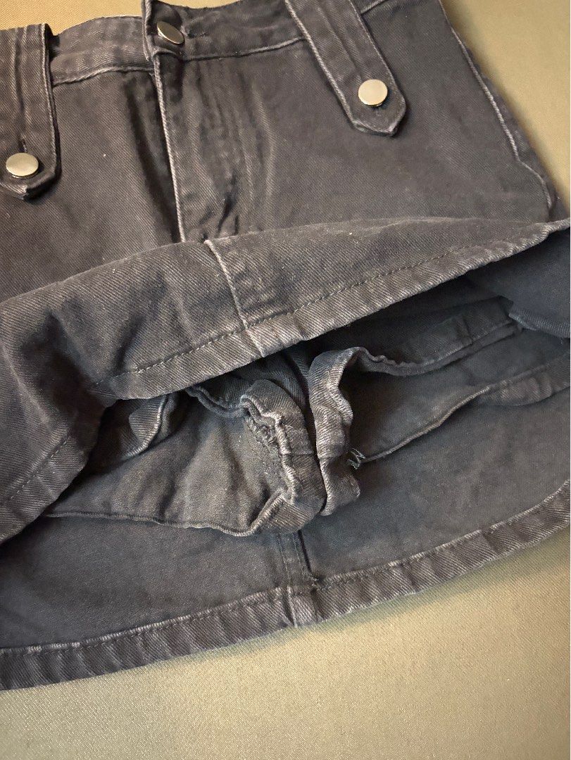 Black Denim Mini Skirt with Front Button Details (Category: Skirts) located in Dasmarinas. Submitted by fionaornopia (Listing ID 1464901777, Image 2). Description: FREE SHIPPING!🚚 - Style: Classic straight cut black denim skirt with dark wash and slight seam fading - Material: Sturdy, high-quality cotton - Details: Decorative front button tabs and functional back pockets - Measurements: Waist 25-26, Length 14 inches - Condition/Use: Versatile ev