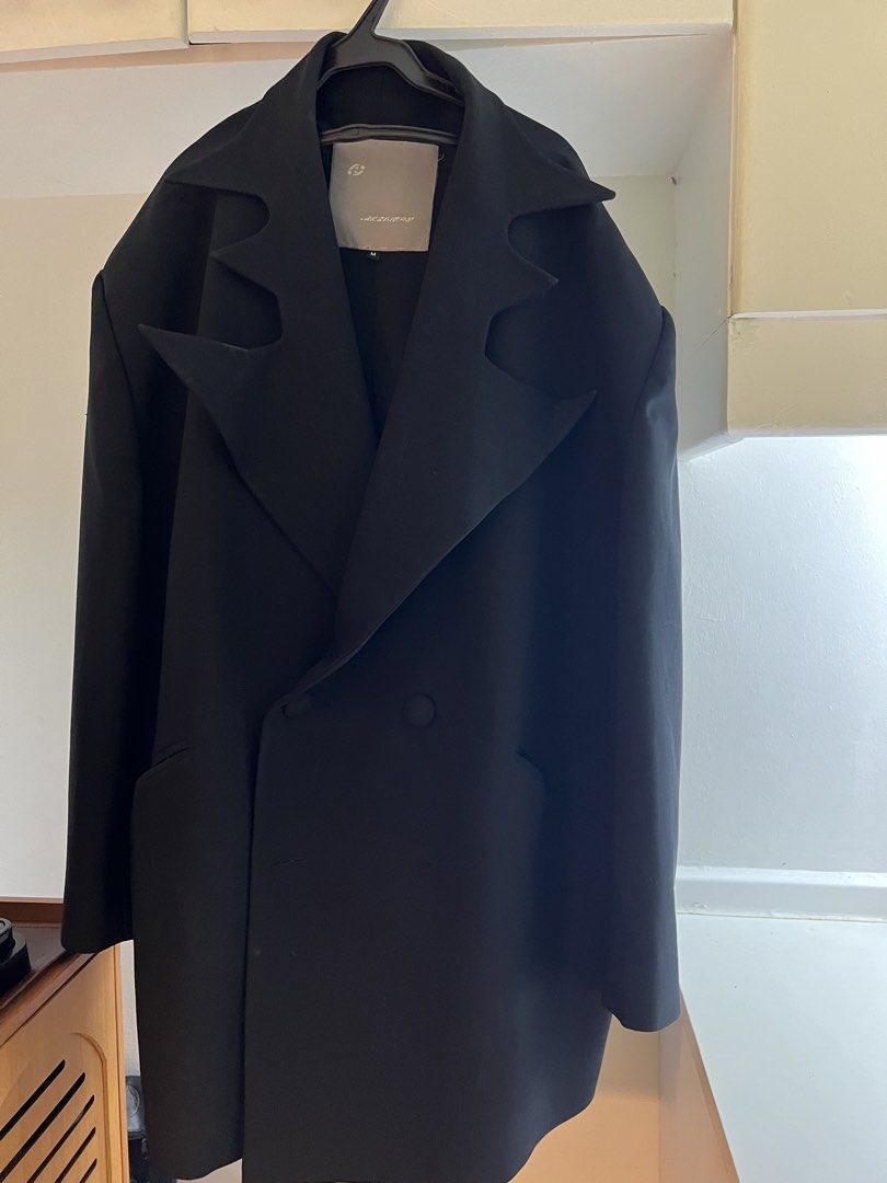 Black Double-Breasted Cutout Collar Coat Size M (Category: Coats, Jackets and Outerwear) located in Mandaluyong City. Submitted by buddybuddy501 (Listing ID 1464907669, Image 1). Description: - Color: Black - Size: M - Style: Double-breasted with a well-structured silhouette - Details: Distinctive cutout design along the collar and lapels, button front closure, and functional side pockets - Condition: Clean dark fabric - Ideal for: Cooler weather