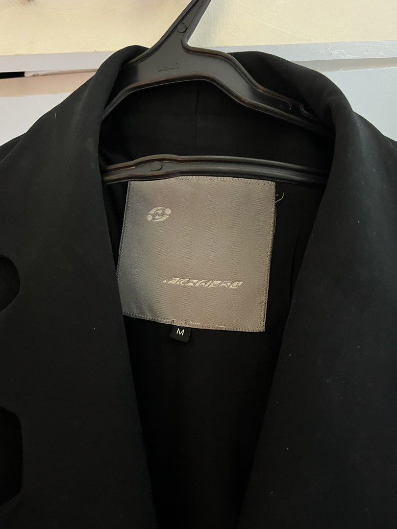 Black Double-Breasted Cutout Collar Coat Size M (Category: Coats, Jackets and Outerwear) located in Mandaluyong City. Submitted by buddybuddy501 (Listing ID 1464907669, Image 2). Description: - Color: Black - Size: M - Style: Double-breasted with a well-structured silhouette - Details: Distinctive cutout design along the collar and lapels, button front closure, and functional side pockets - Condition: Clean dark fabric - Ideal for: Cooler weather
