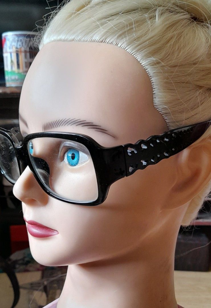 Black frame glasses with patterned temples (Category: Sunglasses & Eyewear) located in Bocaue. Submitted by marajapansurplus (Listing ID 1464806775, Image 2). Description: - Style: Rectangular optical frames in classic black - Lenses: Clear lenses currently installed - Design: Elegant cutout pattern along the side temples - Material: Lightweight plastic construction with standard hinges - Condition: Clean, well-maintained, with no major scratches