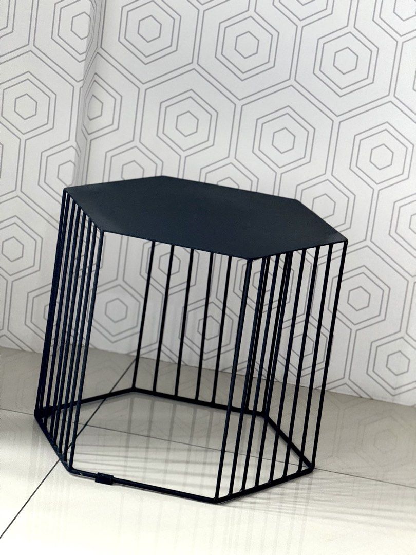 Black Hexagonal Metal Wire Side Table Coffee Table (Category: Tables & Sets) located in Marikina City. Submitted by lovegoeson (Listing ID 1464890136, Image 2). Description: - Modern minimalist black metal side table - Unique geometric hexagon shape with a flat, solid top - Open cage structure featuring sturdy vertical bars all around - Versatile accent piece for the living room or bedroom - Solid and stable condition overall.