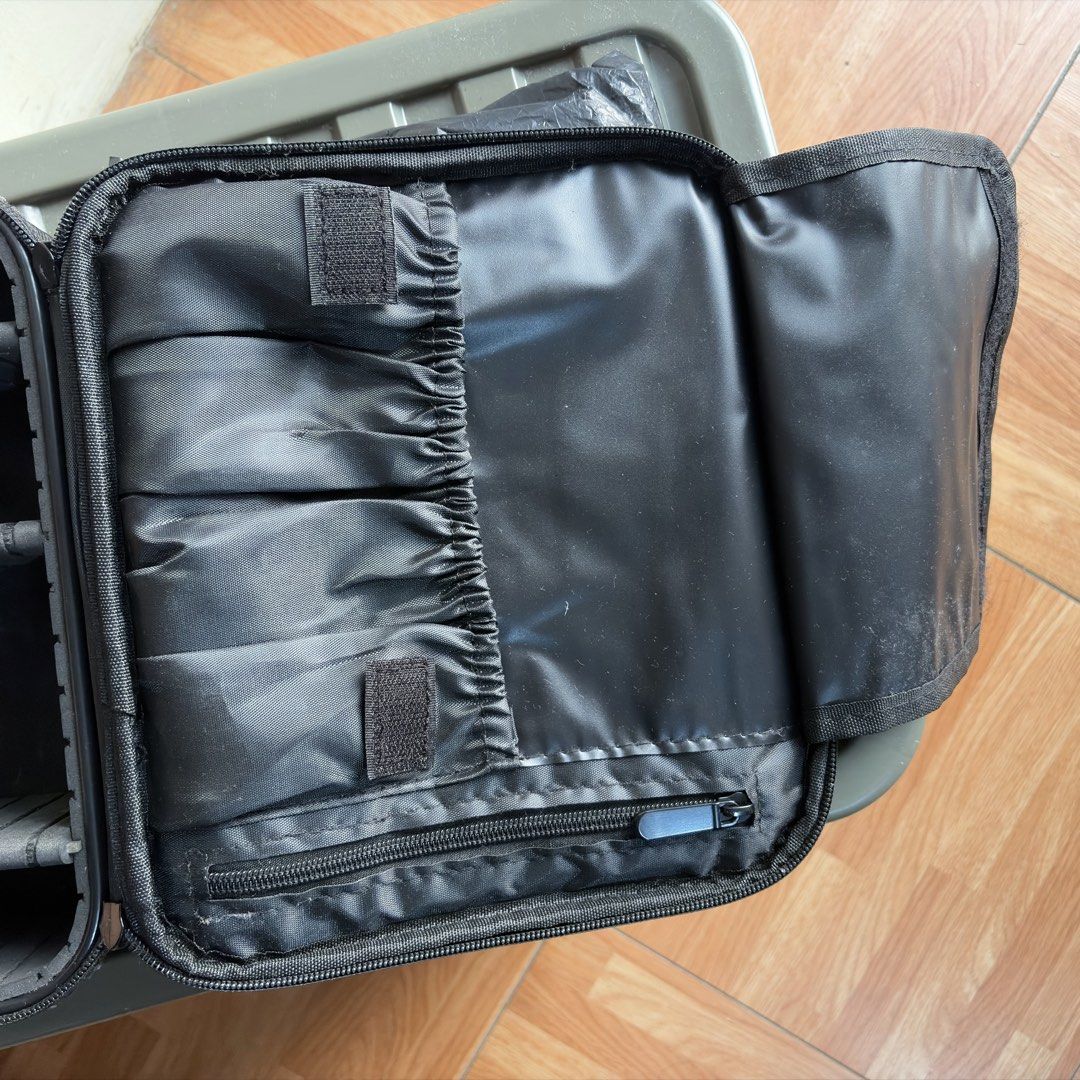 Black Makeup Case Organizer with Adjustable Dividers (Category: Accessory Holder, Box & Organizers) located in Valenzuela. Submitted by cst98 (Listing ID 1464841766, Image 2). Description: - Color: Sleek black travel case - Adjustable foam dividers to customize compartments for makeup, brushes, or gadgets - Lid features multiple elastic brush slots for secure storage - Built-in zipped pocket for extra accessories - Sturdy zip closure to keep all 