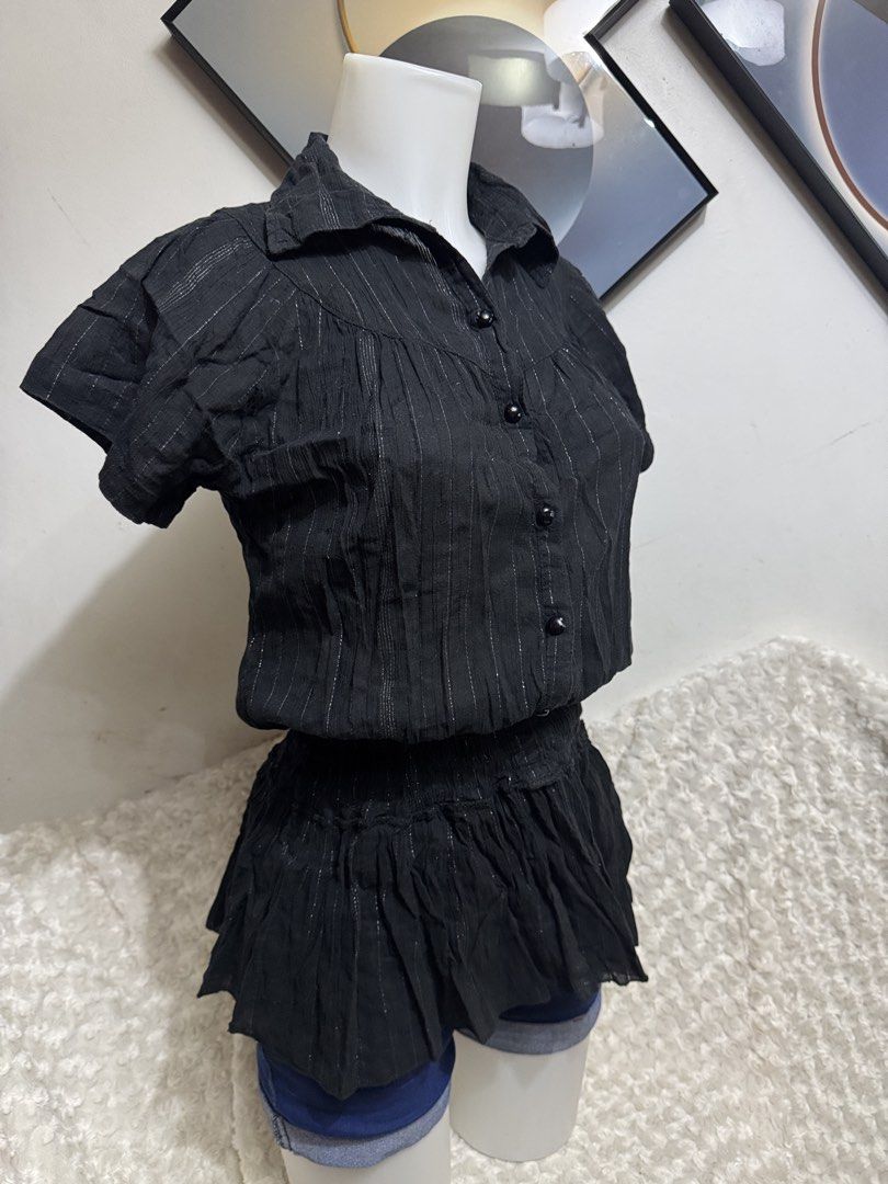 Black metallic pinstripe button-up blouse with peplum hem (Category: Blouses) located in Marikina City. Submitted by lorradel (Listing ID 1464897775, Image 2). Description: - Color: Black with delicate silver pinstripes - Style: Collared neckline, front button closure, and flattering peplum waist - Fabric: Soft, textured crinkle material - Fit: Short sleeves, gathered bodice - Versatility: Easy to dress up with a skirt or keep casual with jeans -