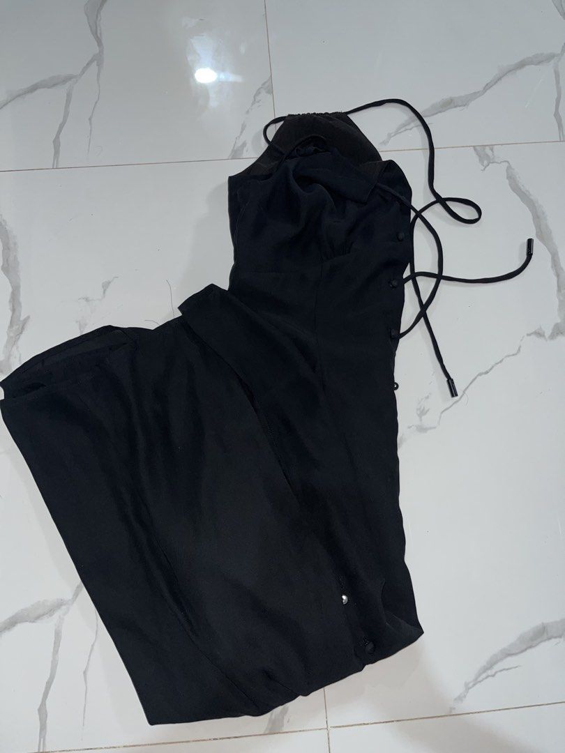 Black sleeveless button-front midi dress with spaghetti straps (Category: Dresses) located in Manila. Submitted by amycol.ph (Listing ID 1464780396, Image 2). Description: - Color: Classic Black - Length: Midi - Design: Thin spaghetti straps and full front button-down closure - Fit: Fitted bodice with a slightly flared skirt - Fabric: Lightweight and versatile for day-to-night wear.