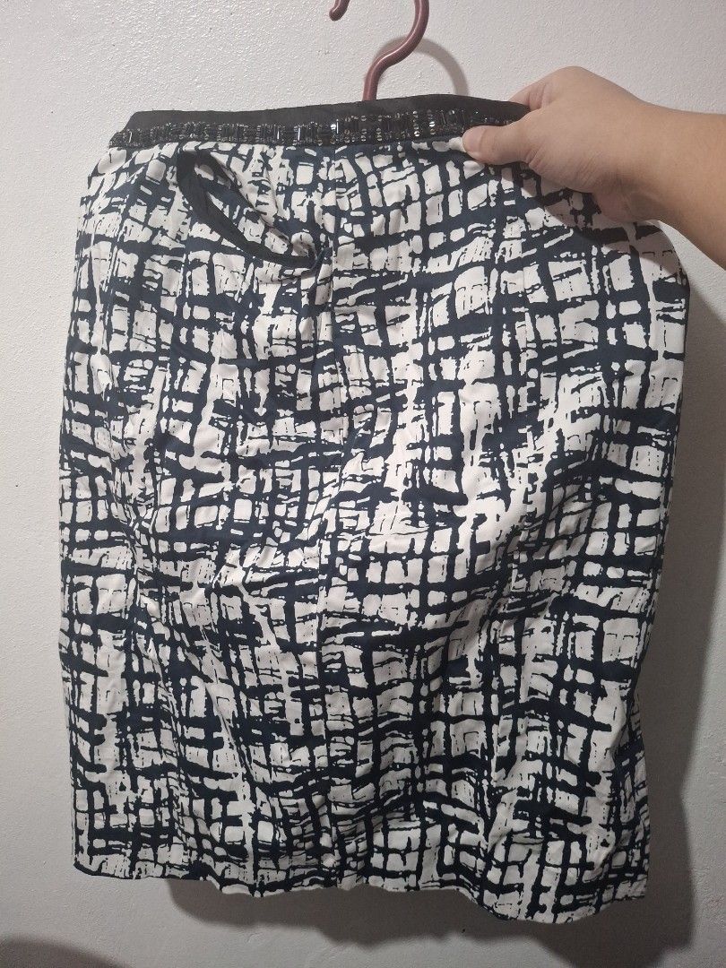 Blue, Black and White Patterned Skirt (Category: Skirts) located in Quezon City. Submitted by 042361 (Listing ID 1464804497, Image 2). Description: - Style: Black and white abstract grid pattern - Waist: Elastic with adjustable drawstring and embellished dark trim - Fabric: Lightweight and versatile for casual or dressed-up looks - Sizing: Measurements available upon request - Inquiries: Drop a message if interested.