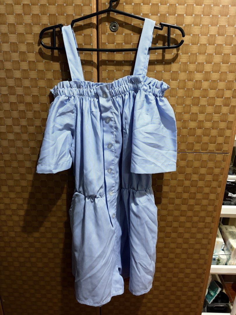 Blue striped off-shoulder romper with buttons and straps (Category: Rompers) located in Pangil. Submitted by chel_anne (Listing ID 1464838648, Image 1). Description: - Style: Blue and white vertical stripe off-shoulder romper - Design: Layered short sleeves, shoulder straps, and clear button-down front - Fit: Comfortable elastic waistband and easy slip-on style - Features: Built-in side pockets - Fabric: Lightweight and breathable, perfect for wa