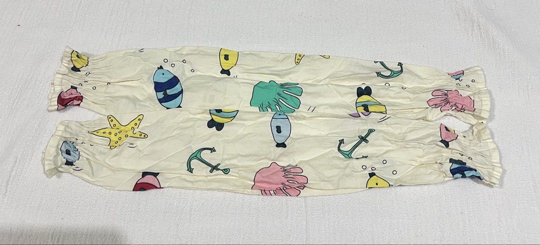 Bolster pillow case for baby (Category: Longsleeves) located in Quezon City. Submitted by charlenedv58782 (Listing ID 1464780413, Image 1). Description: - Adorable ocean animal prints: Features yellow, blue, green, and pink fish, starfish, and anchors on a cream background - Sun protection: Ideal for outdoor activities like driving, cycling, or walking - Secure fit: Equipped with elastic cuffs at both ends to prevent slipping - Lightweight and po