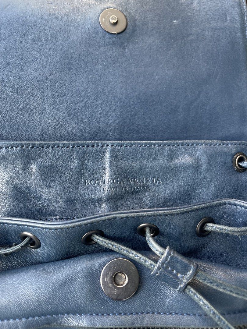 Bottega Veneta Blue Leather Drawstring Backpack (Category: Backpacks) located in Davao. Submitted by houkaygoods (Listing ID 1464967226, Image 2). Description: - Authentic Bottega Veneta blue leather backpack - Features iconic woven leather flap pocket - Secure drawstring closure with magnetic snap buttons - Comfortable adjustable shoulder straps and top handle - Luxurious brown suede interior lining with authenticity tag - Crafted in Italy - Con