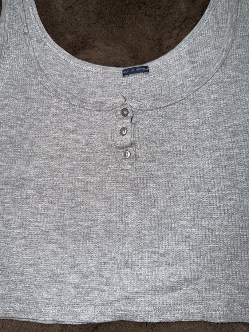 BRANDY MELVILLE gray button tank top (Category: Sleeveless) located in Valenzuela. Submitted by julijulyxoxo (Listing ID 1464863950, Image 2). Description: MOP: maribank, gcash, maya MOD: J&T Express Item is unwashed. Please wash immediately before wearing! 📍san miguel bulacan .