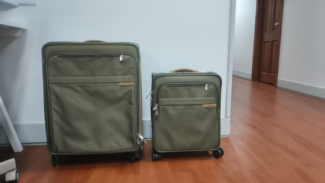 Briggs & Riley Baseline Global/Essential Expandable Carry-On Spinner (Olive) (Category: Luggage) located in Makati City. Submitted by kiwi_thetuxedocat (Listing ID 1464799040, Image 1). Description: Selling a premium Briggs & Riley Baseline Expandable Carry-On Spinner suitcase in their iconic olive green color with classic leather accents. Widely regarded by frequent flyers, pilots, and business travelers as the absolute best carry-on money can b