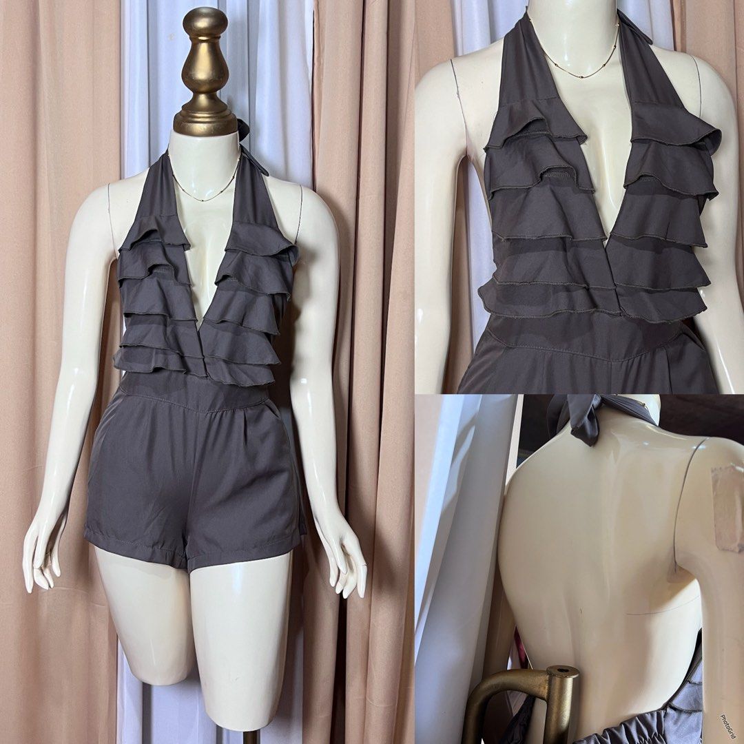 Brown Halter Neck Ruffle Romper (Category: Rompers) located in Kidapawan. Submitted by frizzyjayne (Listing ID 1464863165, Image 1). Description: - Color: Dark brown - Style: Halter neck romper with open back - Design: Deep V-neckline with tiered front ruffles - Fit: Relaxed fit attached shorts - Fabric: Lightweight and breathable - Ideal for: Warm weather days, beach trips, or nights out - Condition: Brand new / Excellent.