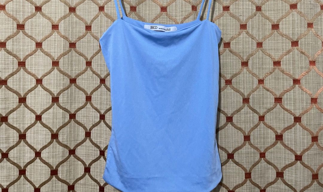 BSCO Blue Spaghetti Strap Tank Top PH XS (Category: Sleeveless) located in Quezon City. Submitted by biabadoobee (Listing ID 1464909463, Image 1). Description: - Brand: BSCO - Color: Light blue - Size: PH XS (tag attached) - Material: Smooth, stretchy fabric - Design: Double spaghetti straps, straight neckline, fitted silhouette - Condition: Clean overall, brand new with tag - Style: Simple basic piece, perfect for casual outfits.