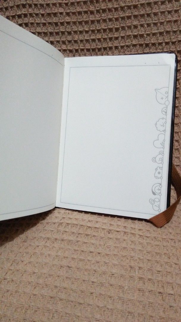 BT21 Shooky Notebook Official BT21 Merchandise (Category: Stationery & School Supplies) located in Valenzuela. Submitted by graciadianna (Listing ID 1464870463, Image 2). Description: - Item: BT21 Shooky Notebook - Material: Black leatherette cover with brown elastic closure band - Details: Official BT21 copyright stamp on the back - Pages: Lined paper with cute character border designs - Condition: Brand new and unused - Ideal for: School, journ