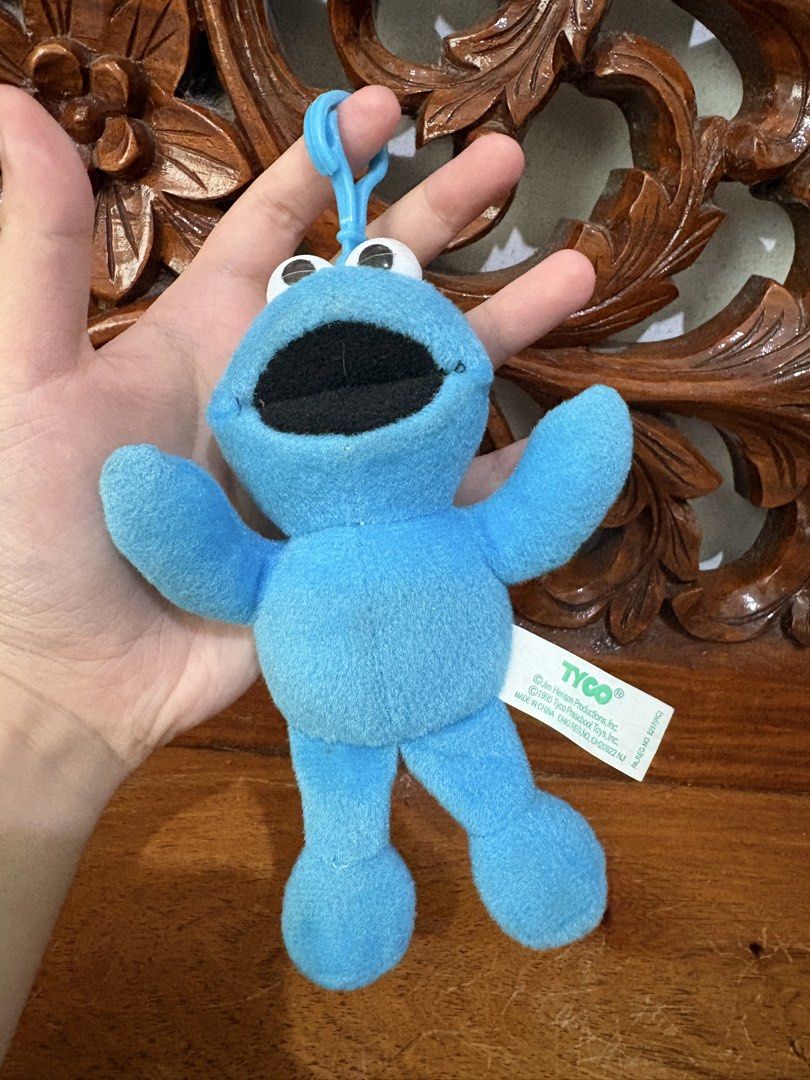 BUNDLE Cookie Monster plush toy keychain (Category: Plushies & Soft Toys) located in Quezon City. Submitted by rxyel (Listing ID 1464779973, Image 3). Description: - Set of 2 Sesame Street Cookie Monster plush keyclips - Includes fuzzy monster with party hat holding a light blue heart - Features rare vintage 1995 Tyco smooth plush toy - Both items are soft, clean, and come with intact original tags - Great retro collectibles for fans and collecto