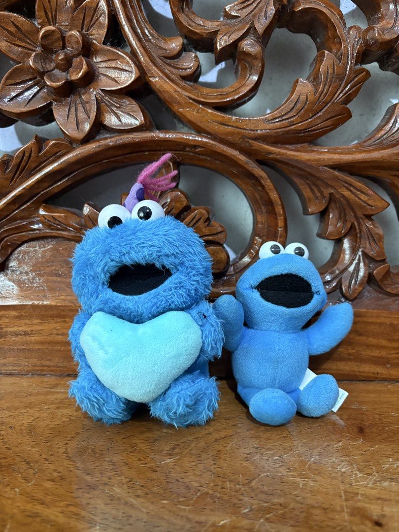 BUNDLE Cookie Monster plush toy keychain (Category: Plushies & Soft Toys) located in Quezon City. Submitted by rxyel (Listing ID 1464779973, Image 1). Description: - Set of 2 Sesame Street Cookie Monster plush keyclips - Includes fuzzy monster with party hat holding a light blue heart - Features rare vintage 1995 Tyco smooth plush toy - Both items are soft, clean, and come with intact original tags - Great retro collectibles for fans and collecto