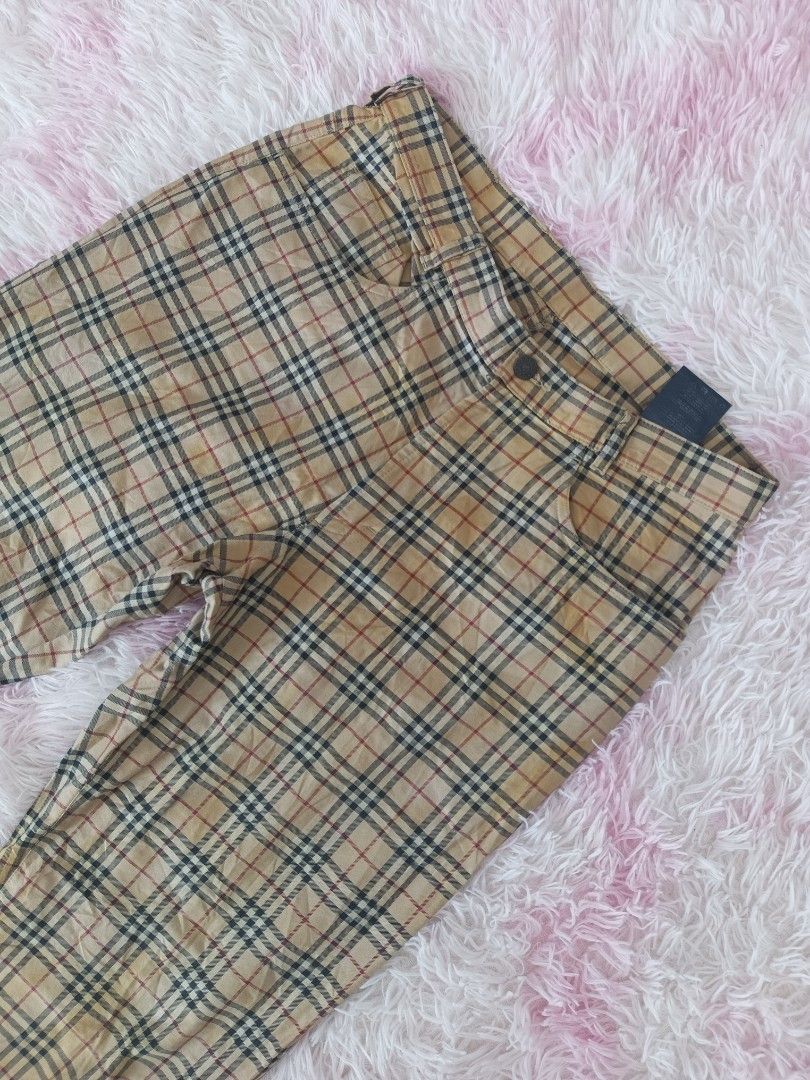 Burberry Vintage Check Trousers (Category: Trousers) located in Jolo. Submitted by zah-zah (Listing ID 1464878936, Image 3). Description: - Authentic Burberry trousers in the iconic vintage check pattern (beige, black, red, white) - Straight leg fit with a classic silhouette - Features functional front pockets and belt loops - Secured with a branded metal button closure - Detailed with a genuine leather brand patch on the back waistline - Fabric 