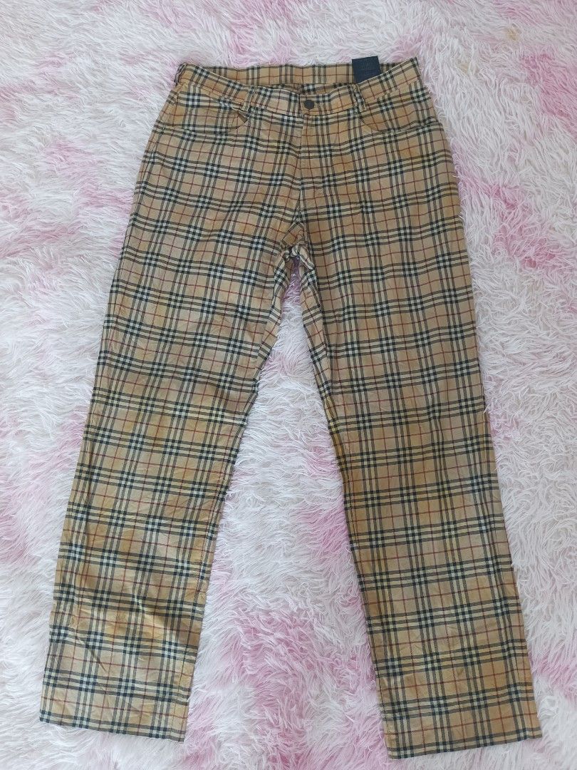 Burberry Vintage Check Trousers (Category: Trousers) located in Jolo. Submitted by zah-zah (Listing ID 1464878936, Image 2). Description: - Authentic Burberry trousers in the iconic vintage check pattern (beige, black, red, white) - Straight leg fit with a classic silhouette - Features functional front pockets and belt loops - Secured with a branded metal button closure - Detailed with a genuine leather brand patch on the back waistline - Fabric 