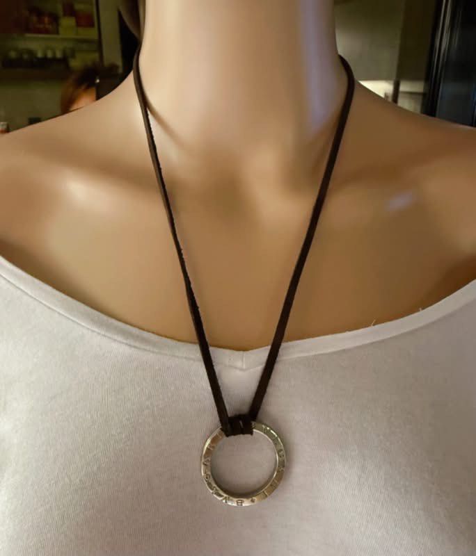 Bv/gari silver ring pendant (Category: Necklaces) located in Manila. Submitted by annafinds (Listing ID 1464876604, Image 1). Description: A Bv/gari silver ring pendant on a dark brown leather cord necklace. ₱7,500 Open for layaway. Disclaimer: We are not affiliated, associated, authorized, endorsed by or in any way officially connected with any other company or luxury brand. All copyrights are reserved to the original brand..