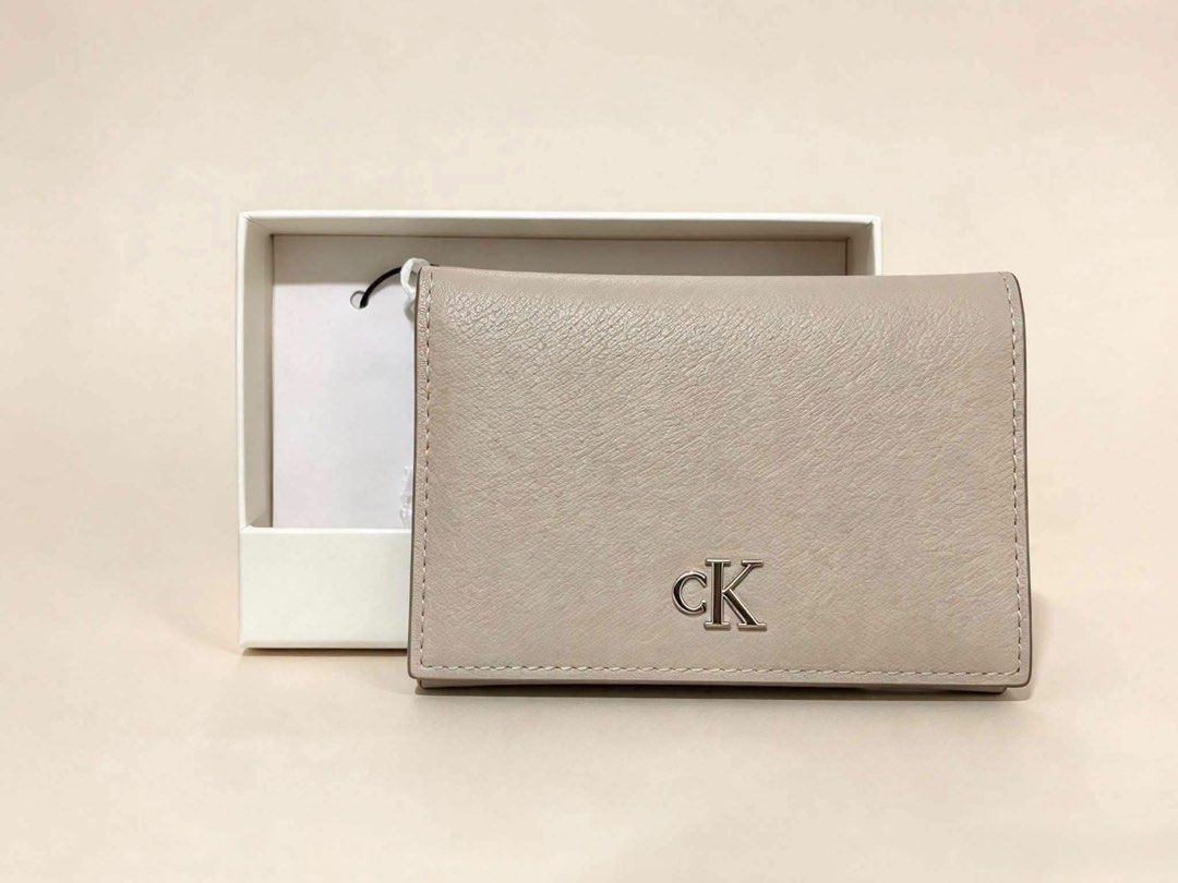 Calvin Klein Monogram Flap Card Case Beige (Category: Wallets & Card holders) located in Santa Rosa. Submitted by miqboutique (Listing ID 1464897921, Image 1). Description: Percect Christmas Gift🎄✨ CK Monogram Flap Card Case ₱1,950 + SF • Ready to ship • Guaranteed Original Fb page: Miq's Boutique.