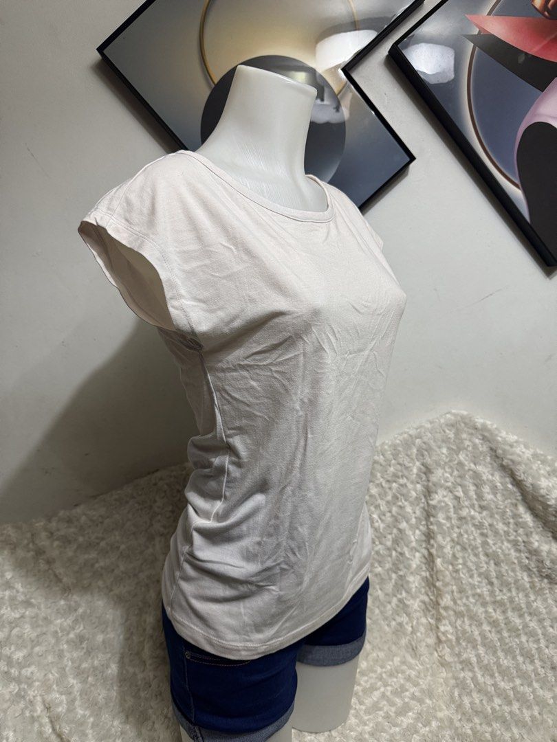 Cap Sleeve Top with Open Back (Category: Shirts) located in Marikina City. Submitted by lorradel (Listing ID 1464901089, Image 2). Description: - fits S-M - Fabric: Soft, comfy cotton - Design: Scoop neckline, cap sleeves, and a striking open V-back with a horizontal strap - Fit: Relaxed and easy to match with jeans or shorta - MAY HAVE some washable stains (hindi maiiwasan) needs washing; had been stored - mannequin size 34-26-34 - mannequin’s s