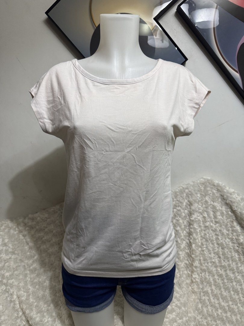 Cap Sleeve Top with Open Back (Category: Shirts) located in Marikina City. Submitted by lorradel (Listing ID 1464901089, Image 1). Description: - fits S-M - Fabric: Soft, comfy cotton - Design: Scoop neckline, cap sleeves, and a striking open V-back with a horizontal strap - Fit: Relaxed and easy to match with jeans or shorta - MAY HAVE some washable stains (hindi maiiwasan) needs washing; had been stored - mannequin size 34-26-34 - mannequin’s s