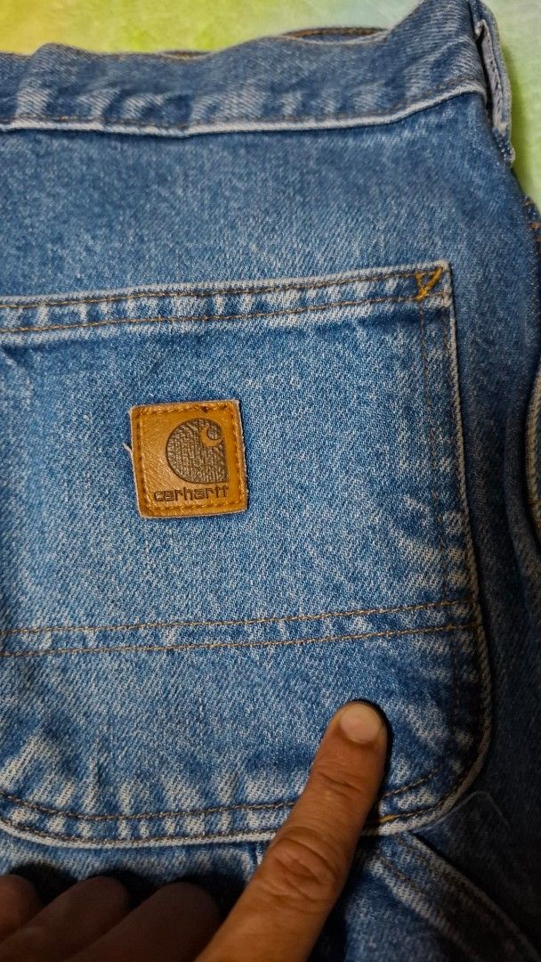 Carhartt B237 DST Dungaree Fit Jeans (Category: Jeans) located in Quezon City. Submitted by panicbuyer461 (Listing ID 1464936701, Image 2). Description: - Brand: Carhartt - Style: B237 DST Dungaree Fit Carpenter Jeans - Size: Tagged 30 x 32 - Features: Utility pockets, hammer loop, metal button closure, and classic leather logo patch on the pocket - Waist : 15.5 inches - Length: 42 inches.