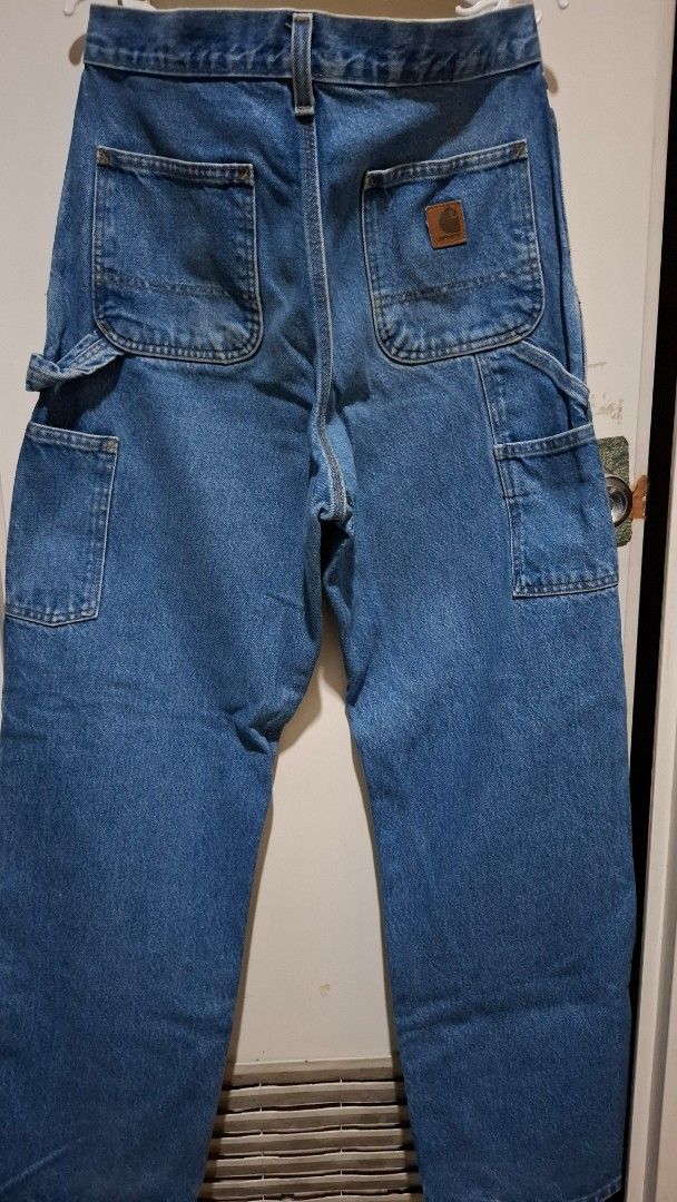 Carhartt B237 DST Dungaree Fit Jeans (Category: Jeans) located in Quezon City. Submitted by panicbuyer461 (Listing ID 1464936701, Image 3). Description: - Brand: Carhartt - Style: B237 DST Dungaree Fit Carpenter Jeans - Size: Tagged 30 x 32 - Features: Utility pockets, hammer loop, metal button closure, and classic leather logo patch on the pocket - Waist : 15.5 inches - Length: 42 inches.