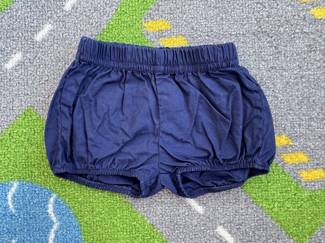 Carter’s Navy Blue Bloomers Shorts (Category: Babies & Kids Fashion) located in Rizal. Submitted by preloovved (Listing ID 1464872789, Image 1). Description: Navy blue baby bloomers in soft cotton. Features a comfy elastic waistband and leg openings. A versatile everyday basic that easily matches any top or onesie. Navy blue baby shorts with elastic waistband and gathered design. Soft, comfortable fabric. Perfect for casual wear. Preloved, newbor