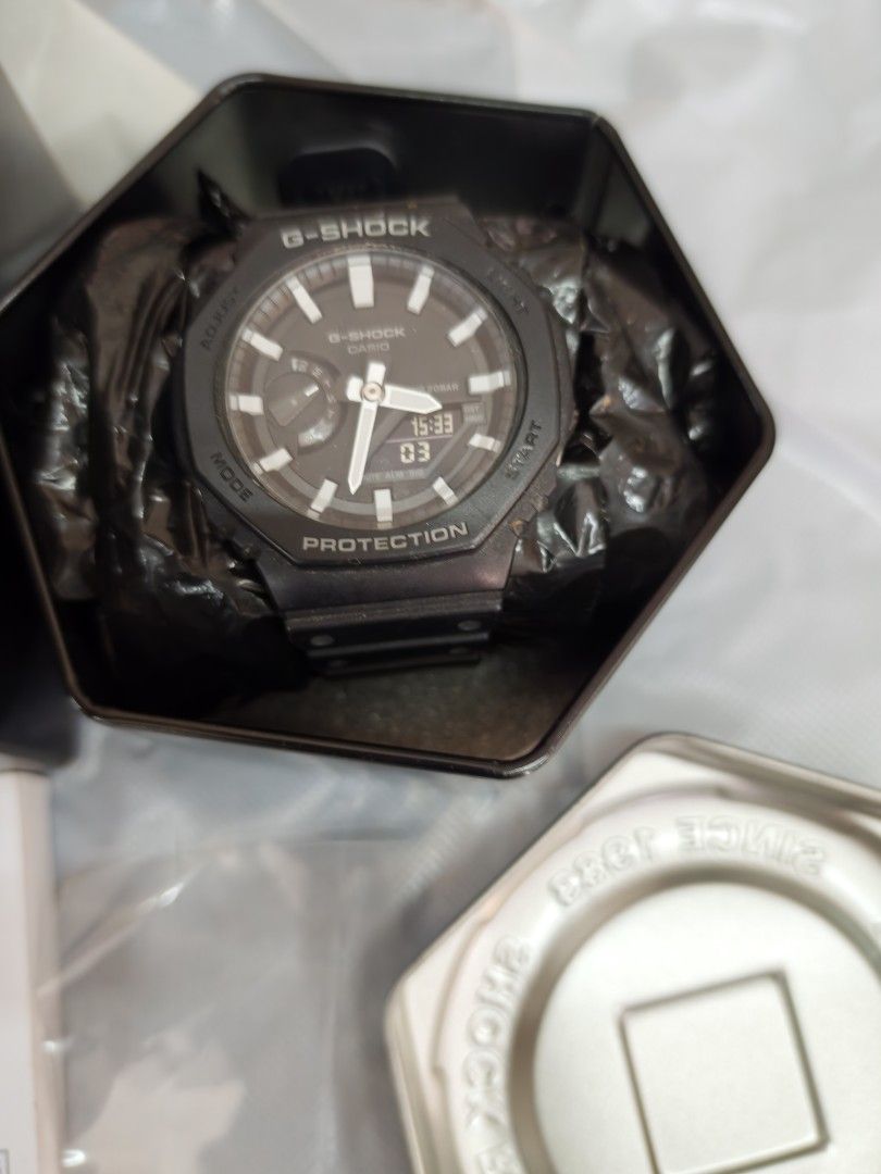 Casio G-Shock GA-2100 Black Watch (Category: Men's Watches) located in Quezon City. Submitted by livedragon.c2ab08 (Listing ID 1464832521, Image 1). Description: Priced to sell / Also willing to Trade for ( GMA2100 or DW5600 solar) - Model: Casio G-Shock GA-2100 - Color: Black with white Indices - Design: Iconic octagonal bezel with analog hands and digital display window - Strap: Durable resin with secure metal buckle - Condition: Used / Complet