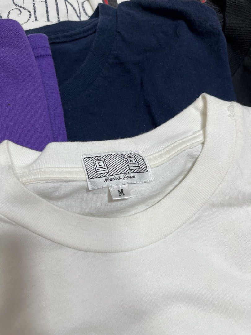 Cav Empt White Graphic Tee Size M (Category: Tshirts & Polo Shirts ) located in Baao. Submitted by plainclothesdept (Listing ID 1464780209, Image 3). Description: Cav Empt Pink Tee width - 21 in. length- 26 in. minimal discoloration near armpit - Brand: Cav Empt - Style: White graphic tee - Size: Medium - Origin: Made in Japan - Design details: Pink front chest graphic, cross branding near the collar, and 'Cav Empt' lettering down both sleeves - 