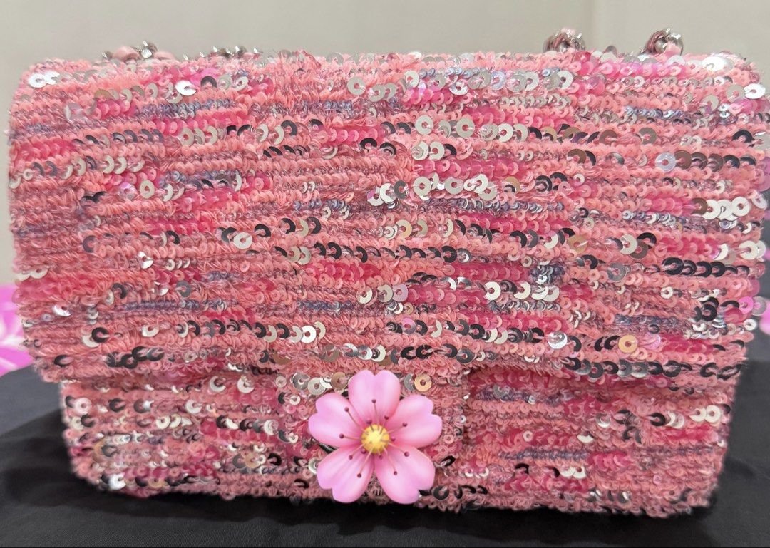 CC Pink Sequin Tweed Flap Bag (Category: Shoulder Bags) located in Manila. Submitted by klaaaa.24 (Listing ID 1464784736, Image 1). Description: ‼️AUTHENTICITY NOT GUARANTEE‼️ - Japan source - Style: Pink sequin and tweed shoulder bag - Details: Features a pink floral embellishment on the front flap - Straps: Shiny silver-toned hardware woven with pink material - Just bought last week - Comes with CC black dust bag RFS: already purchase another p