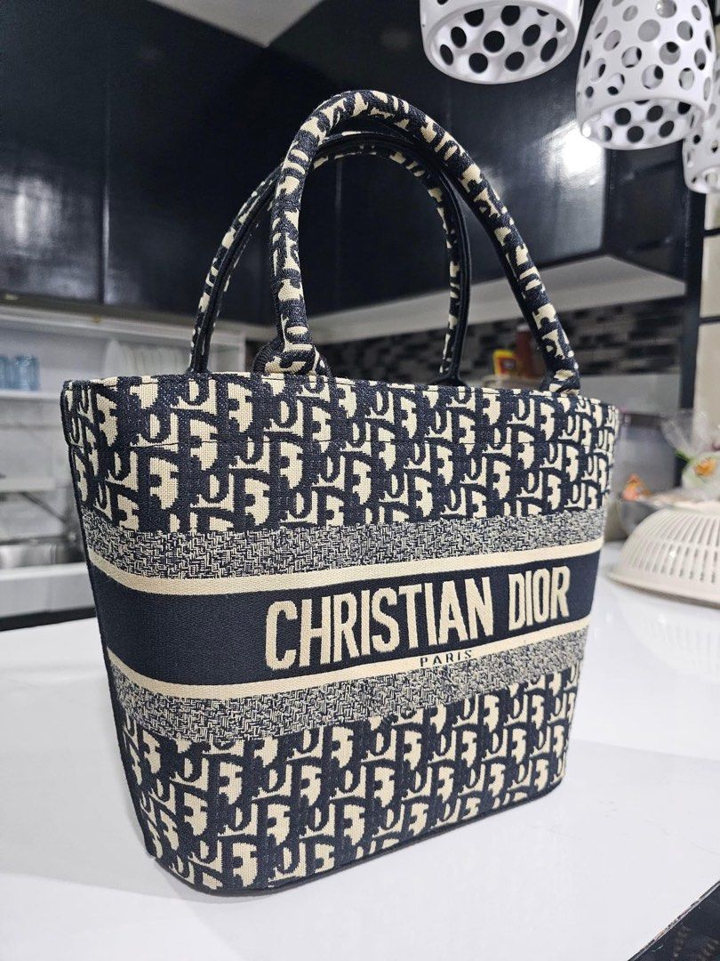 CD Bucket Bag (Category: Tote Bags) located in Davao. Submitted by theresetshelf (Listing ID 1464965798, Image 1). Description: 👜Can carry a lot 👜Cute for picnics and beach 👜Can put ur babys essential 👜authenticity not guaranted .