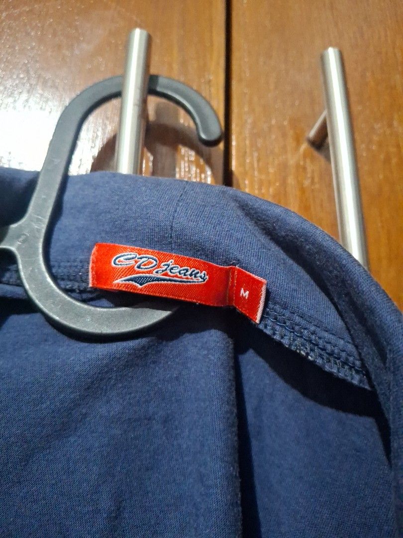 CD Jeans Blue Crop Jacket Size M (Category: Coats, Jackets and Outerwear) located in Quezon City. Submitted by 042361 (Listing ID 1464851933, Image 2). Description: - Brand/Model: CD Jeans Blue Crop Jacket - Size: Medium (tag inside) - Design details: Short sleeves with white and navy striped cuffs, front button accents on pockets, and structured collar neckline - Condition: Clean and ready to wear - Style: Great layering piece for casual outfits