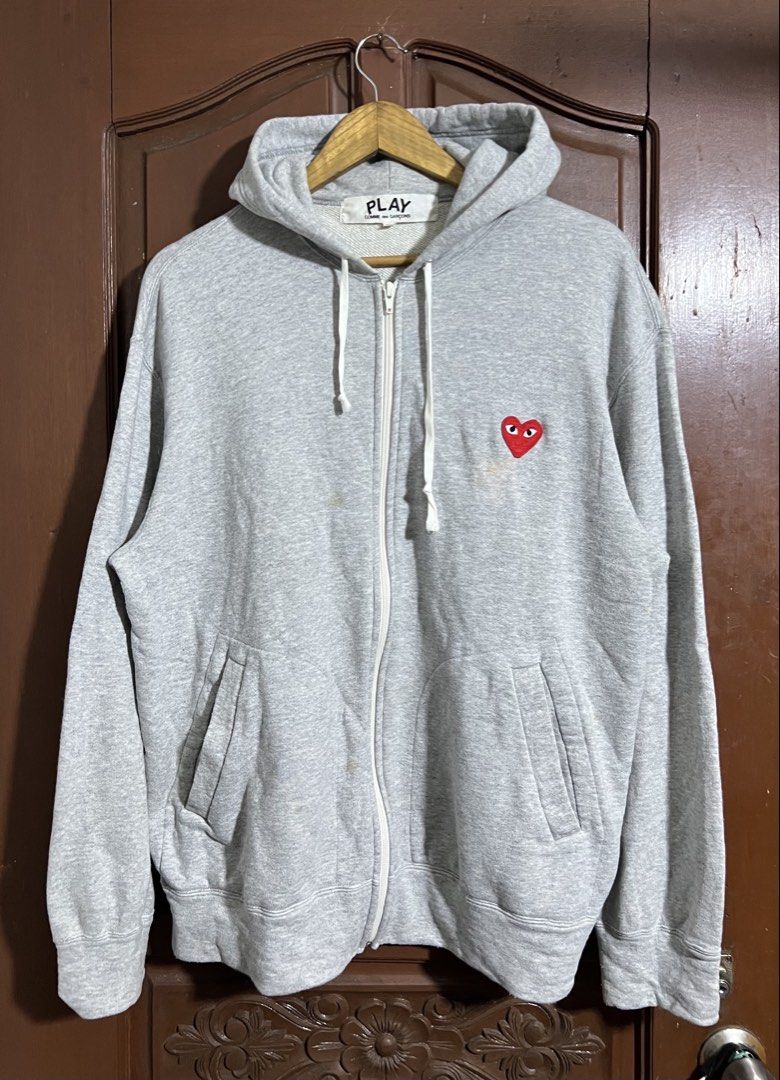CDG Play Gray Zip Up Hoodie (Category: Coats, Jackets and Outerwear) located in Manila. Submitted by thriftpoint99 (Listing ID 1464887042, Image 1). Description: 24.5x28.5 Issue stains Good condition.