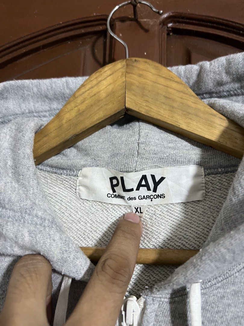 CDG Play Gray Zip Up Hoodie (Category: Coats, Jackets and Outerwear) located in Manila. Submitted by thriftpoint99 (Listing ID 1464887042, Image 2). Description: 24.5x28.5 Issue stains Good condition.