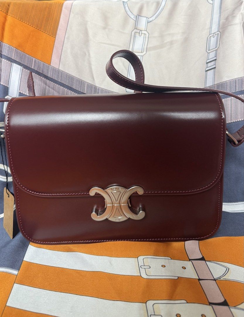 Celine Triomphe body bag Oxblood (Category: Cross-body Bags) located in Manila. Submitted by prelovedrepubliq (Listing ID 1464846041, Image 1). Description: Celine Triomphe Body bag in oxblood Comes with dustbag only Genuine leather Not Guarranteed Auth.
