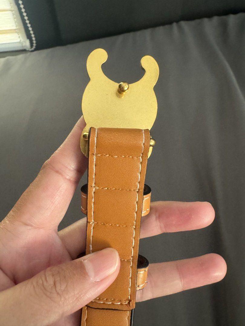 Celine Triomphe Tan Leather Belt Size 105 (Category: Belts) located in Rizal. Submitted by thrifty.mom (Listing ID 1464793499, Image 3). Description: - Brand: Celine - Material: Tan leather with white contrast stitching - Hardware: Gold-tone Triomphe buckle - Size: 105 (Made in Italy) - Fit: Adjustable with multiple punch holes - Condition: Clean, minimal wear on strap and hardware Preloved thrift sourced No guarantee no inclusions.