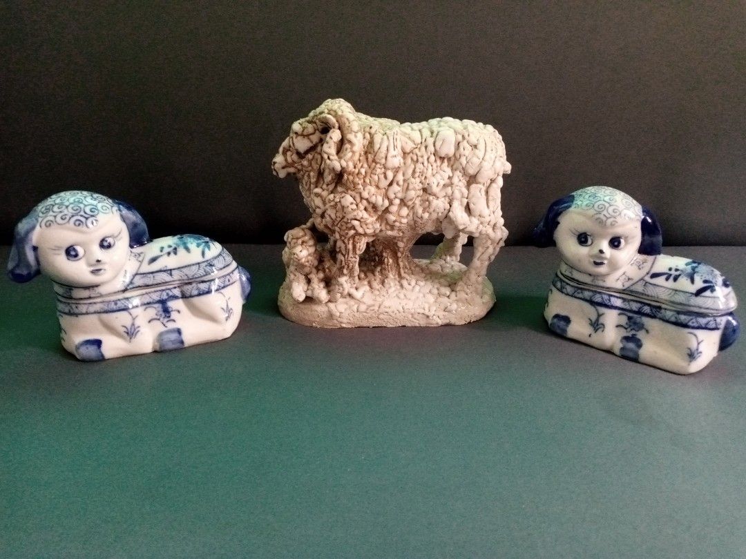 Ceramic sheep figurine set with two blue and white trinket boxes (Category: Figurines & Statues) located in General Trias. Submitted by dwyane09 (Listing ID 1464818119, Image 1). Description: - 3-piece ceramic sheep decor set - Centerpiece: Textured off-white sheep with a little lamb - Side pieces: 2 blue and white porcelain resting lamb trinket boxes with human-like faces and detailed painted fleece - Ideal for shelf displays, home decor, or col