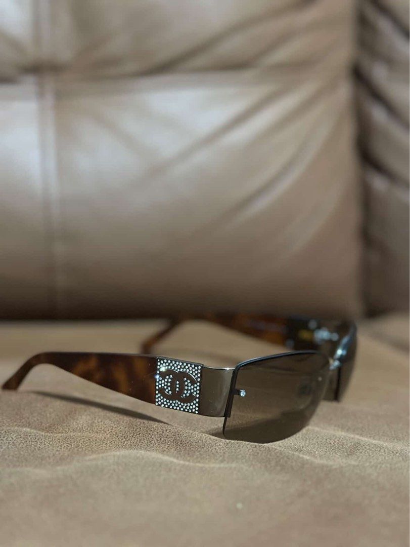 Chanel 4117-B Rhinestone Tortoiseshell Sunglasses (Category: Sunglasses & Eyewear) located in Manila. Submitted by _prelovedbynotcarls (Listing ID 1464823425, Image 1). Description: - Brand: Chanel - Model: 4117-B c.275/13 (Y2K vintage classic) - Frame: Tortoiseshell arms with sparkling rhinestone CC logo - Lenses: Gradient brown - Size: 62-16 125 (stamped on inner temple) - Origin: Made in Italy - Condition: Great overall condition.