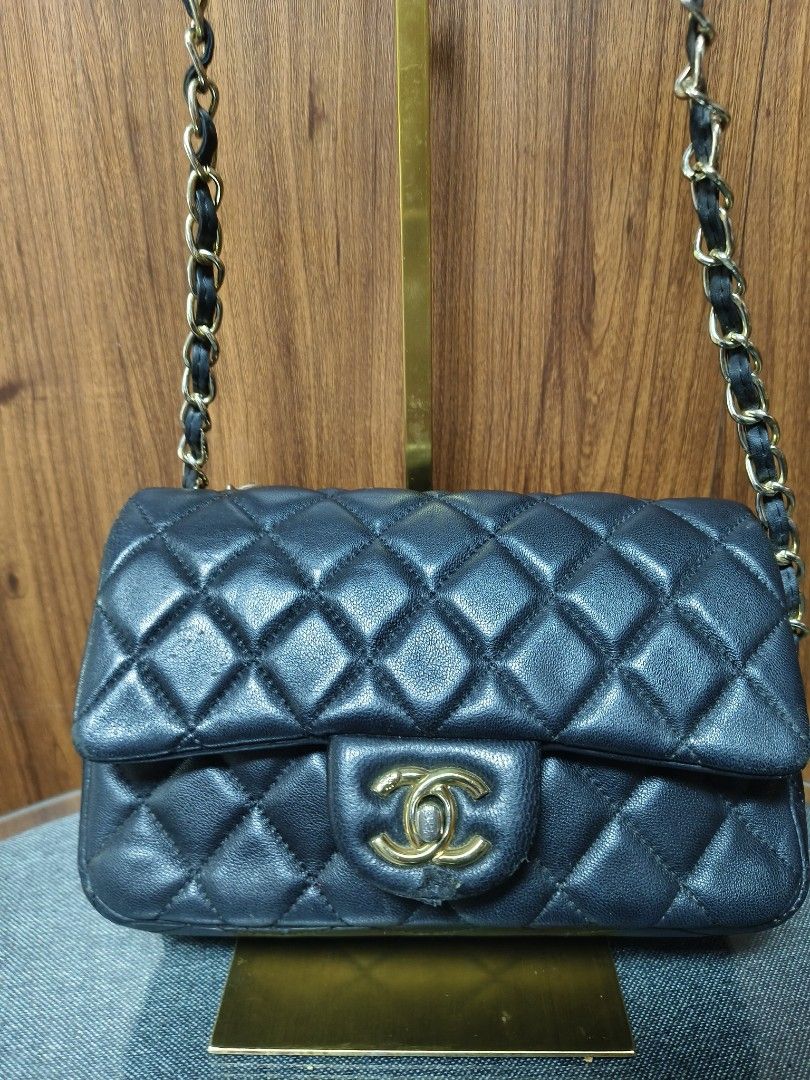 Chanel Classic Quilted Black Flap Bag (Category: Luxury Bags & Wallets) located in Baguio. Submitted by PreiLoveMaria (Listing ID 1464901079, Image 3). Description: Chanel Classic Quilted Black Flap Bag design with gold-tone hardware, a woven leather-and-chain strap, and a burgundy interior lining with a zip pocket. Includes an interior serial sticker. Noticeable wear and scuffing on the front turn-lock closure tab and signs of wear on the interi