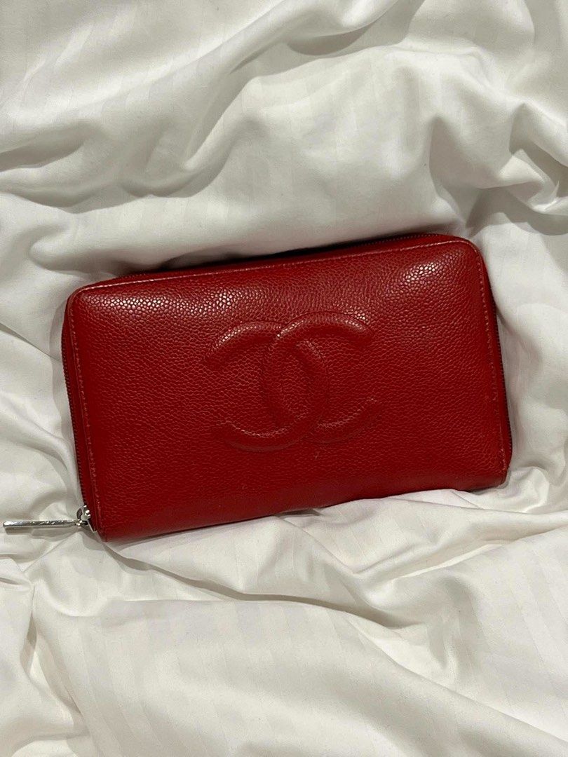 Chanel Red Caviar Leather Zip Around Wallet (Category: Wallets & Card holders) located in Quezon City. Submitted by luxuriesbymichiika (Listing ID 1464899680, Image 1). Description: - Brand: Chanel - Style: Zip-around long wallet - Material: Durable caviar leather in vibrant red - Hardware: Silver-tone hardware and zipper pull - Design: Large embossed interlocking CC logo on the front - Functionality: Secure compartment for cards, cash, and coins